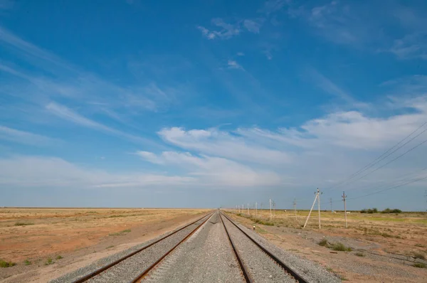 Railroad, railway tracks railings going to the horizon — Stok fotoğraf