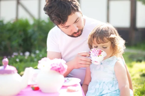 Cute little princess playing tea party with her loving father — Stock Photo, Image