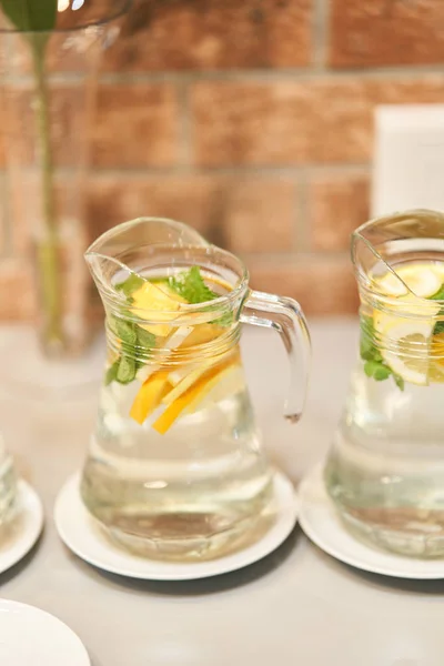 Fresh mojito with mint and lemon in a decanter — Stock Photo, Image