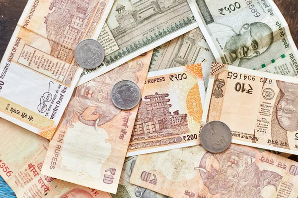 Indian rupees. Indian money, banknotes, and coins in denominations of 1, 2, 10, 20, 200, 500.