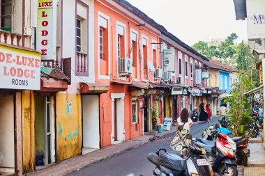 Panaji, India - December 15, 2019: A narrow lane surrounded by colorful portuguese houses in Panjim, Goa clipart