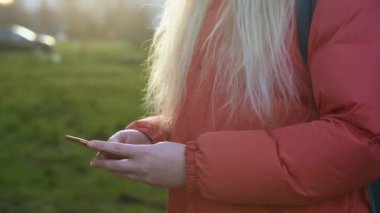 Overhead hacker in the hood working with laptop typing text in the darkroom. 