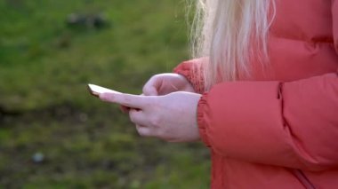 Overhead hacker in the hood working with laptop typing text in the darkroom. 