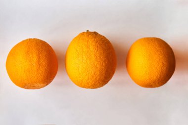 A group of oranges on a table clipart
