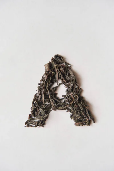 Τσάι από φύλλα. Η επιγραφή Α σε λευκό φόντο. — Φωτογραφία Αρχείου