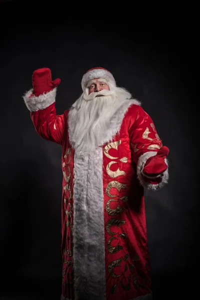 Santa claus op een zwarte achtergrond. — Stockfoto