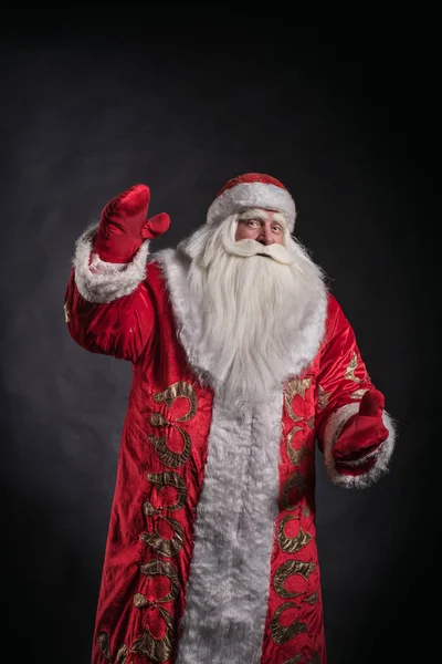 Papai Noel em um fundo preto . — Fotografia de Stock