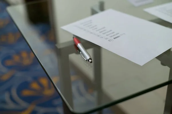 Metallic Red Writing Hand Lying Glass Table — Stock Photo, Image