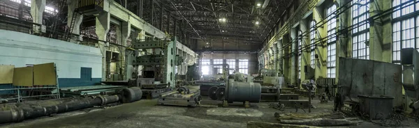 Industrial landscape at the factory, view of a huge workshop with metalworking and metal cutting machines.