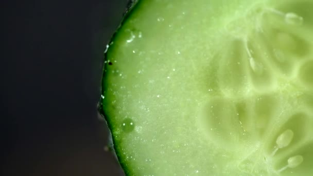 Juicy Ripe Single Green Cucumber Sliced Half Macro Black Background — Stock Video