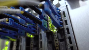 RUSSIA, MOSCOW - February 05, 2020: Technician plugging patch cable in a rack mounted server