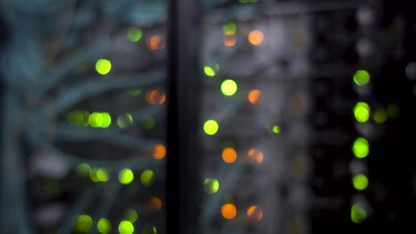 Colorful bokeh with blinking multicolored neon lights server room. — Stock Video