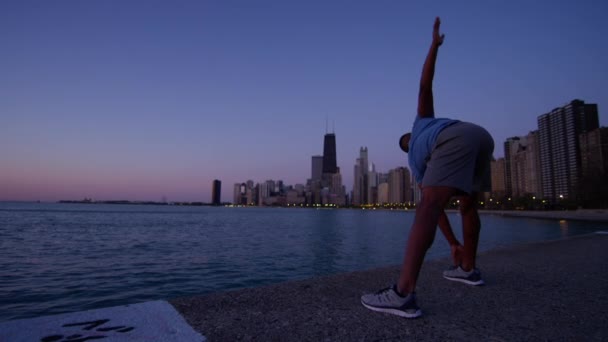 Male stretching outdoors — Stock Video