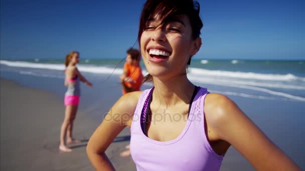 Sportswoman relaxing on the beach — Stock Video