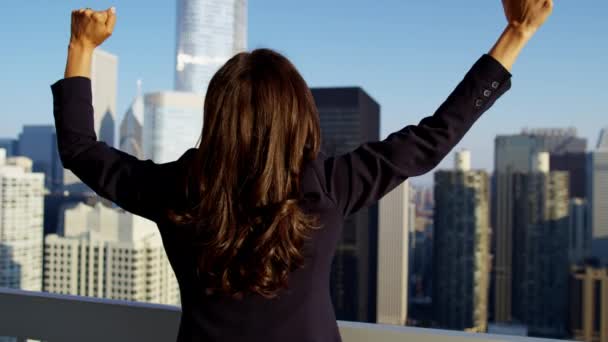 Businesswoman with arms up celebrating success — Stock Video