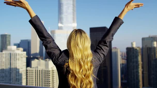 Female celebrating success on rooftop — Stock Video