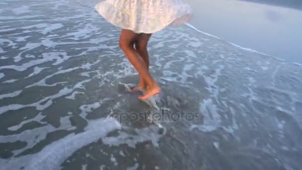 Emale dancing barefoot on beach — Stock Video