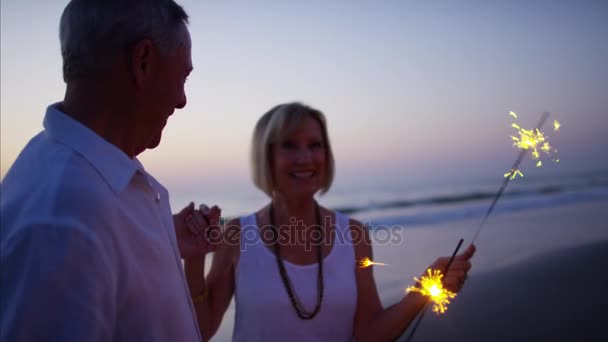 Couple enjoying party with sparklers — Stock Video