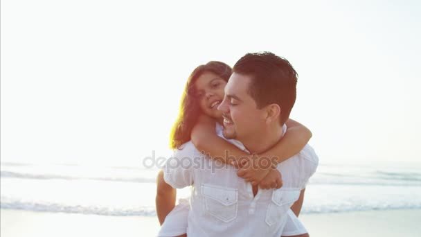 Girl enjoying time with father on beach — Stock Video