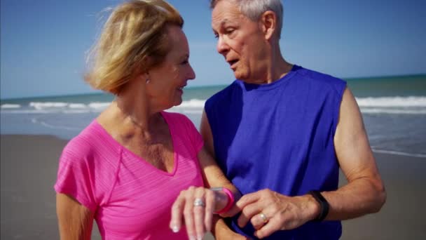 Couple using sport watch — Stock Video