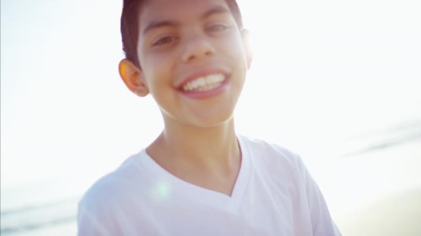 Boy spending vacation at a beach — Stock Video