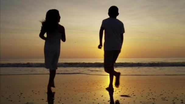 Parents and children having fun on the beach — Stock Video