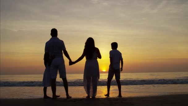 Family on beach at sunrise — Stock Video