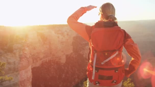 Female standing on the rocky edge — Stock Video