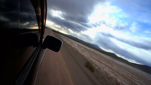 Vehicle travelling across the desert — Stock Video