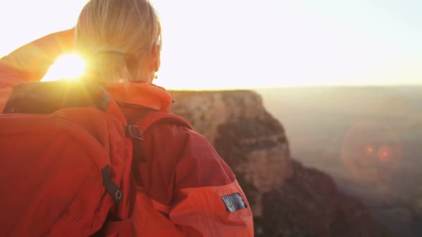 Female standing on the rocky edge — Stock Video