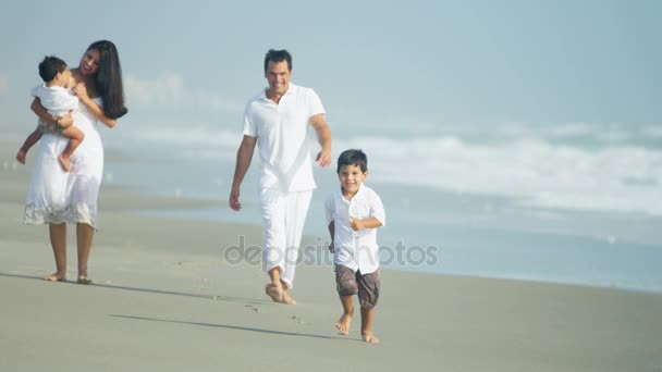 Family enjoying togetherness by the ocean — Stock Video