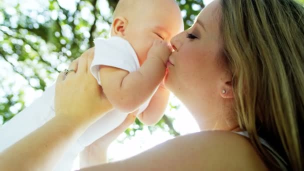 Baby with mom kissing her — Stock Video