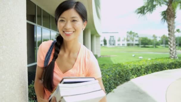 Student holding workbook — Stock Video