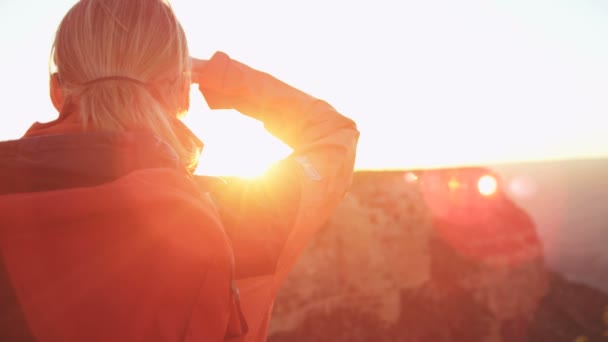 Female standing on the rocky edge — Stock Video