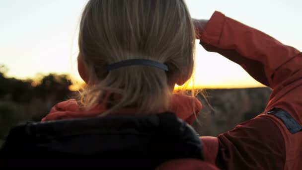 Female standing on the rocky edge — Stock Video