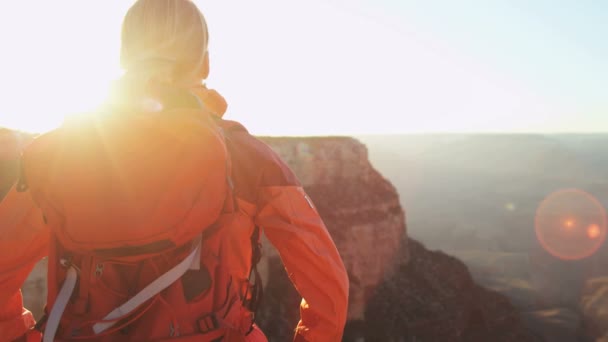 Female standing on the rocky edge — Stock Video