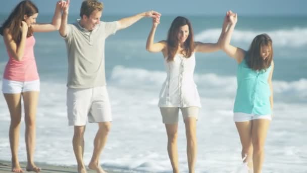 Male and females paddling in the sea — Stock Video