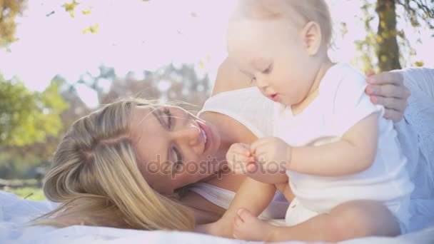 Mother kissing her young baby girl — Stock Video