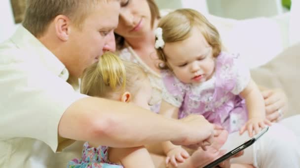 Parents and girls playing  on tablet — Stock Video