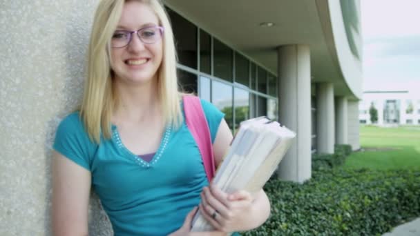 Girl holding workbook — Stock Video