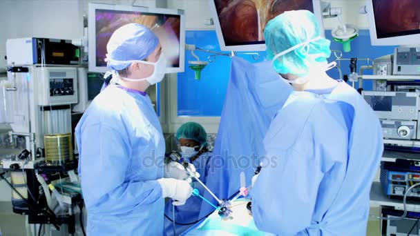 Surgical team performing laparoscopic surgery — Stock Video