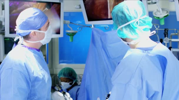 Surgical team performing laparoscopic surgery — Stock Video