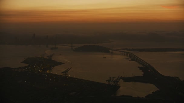 Aerial Sunset Haze View Illuminated Oakland Port Docks Bay Bridge — Stock Video