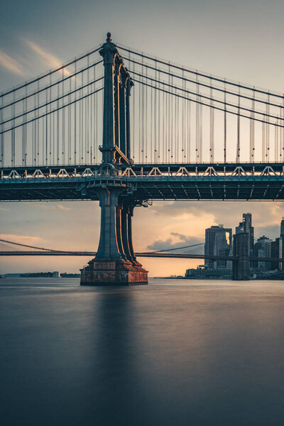 Brooklyn Bridge and Manhattan Bridge night skyline panorama in Manhattan, New York, USA