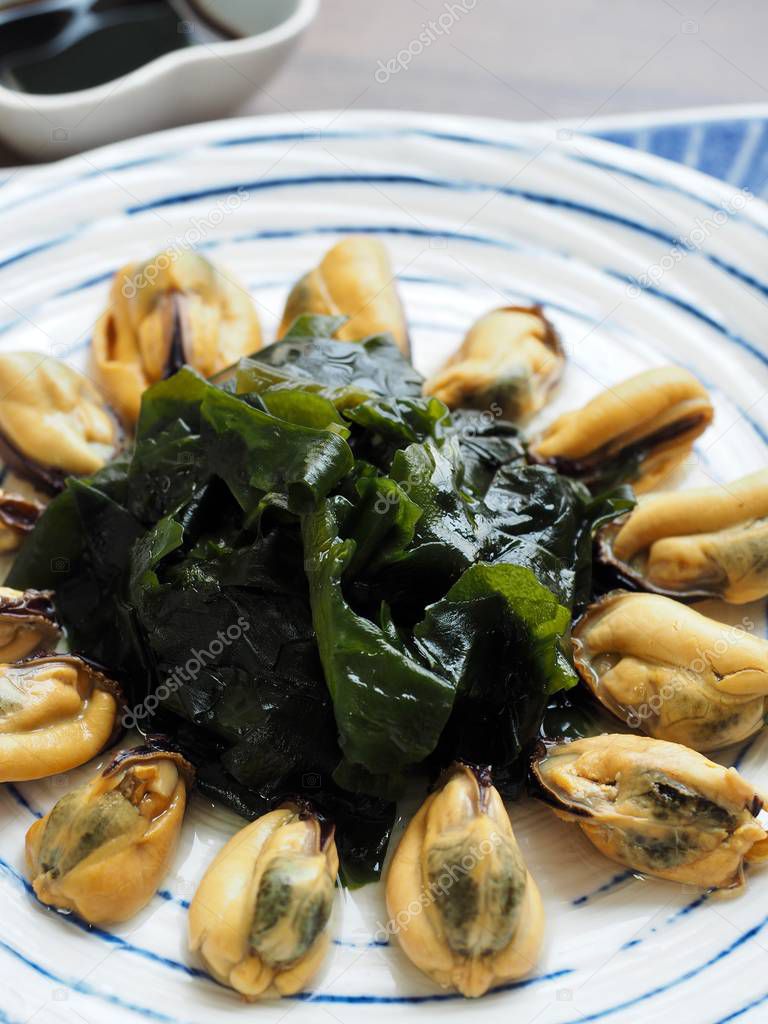 Asian food mussels and seaweed and soy sauce