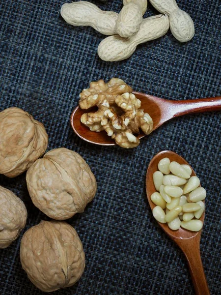 Pine nuts and Spoon and walnut