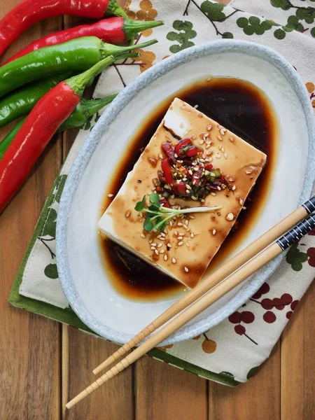 Asian food soft tofu and Soy sauce