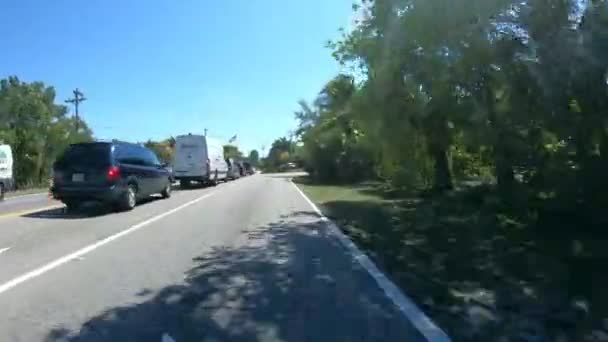 Driving down the road to Sanibel Island - Florida Fort Myers - first person view — Stock Video