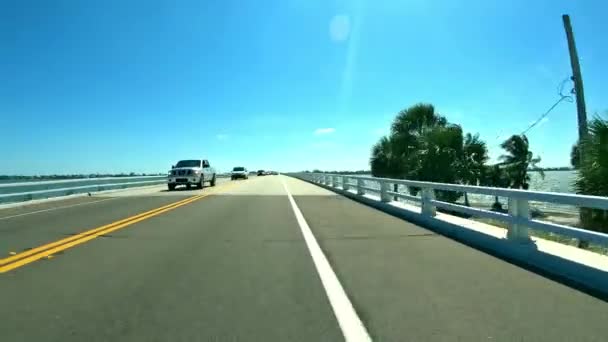 Driving down the road to Sanibel Island - Florida Fort Myers - first person view — Stock Video