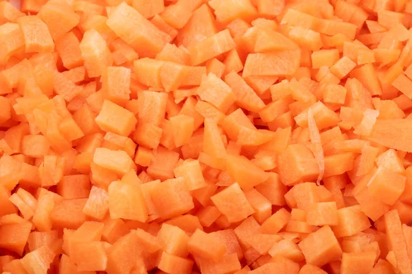 fresh carrots cut into cubes close up